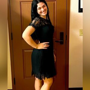 Black lace dress, short, pleated, size 8, knee length, never worn.